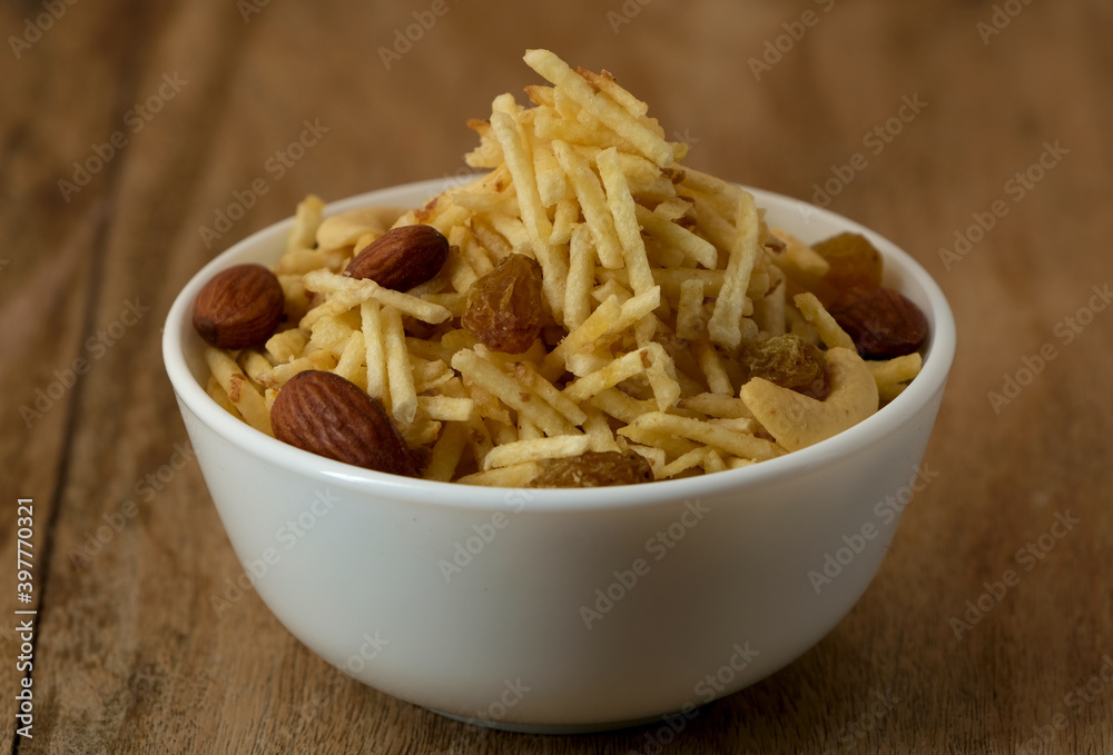 Indian style deep fried snacks falahari chivda- chivda or mixture namkeen with dry fruits. Indian style deep fried snacks falahari chivda- chivda or mixture namkeen with dry fruits.