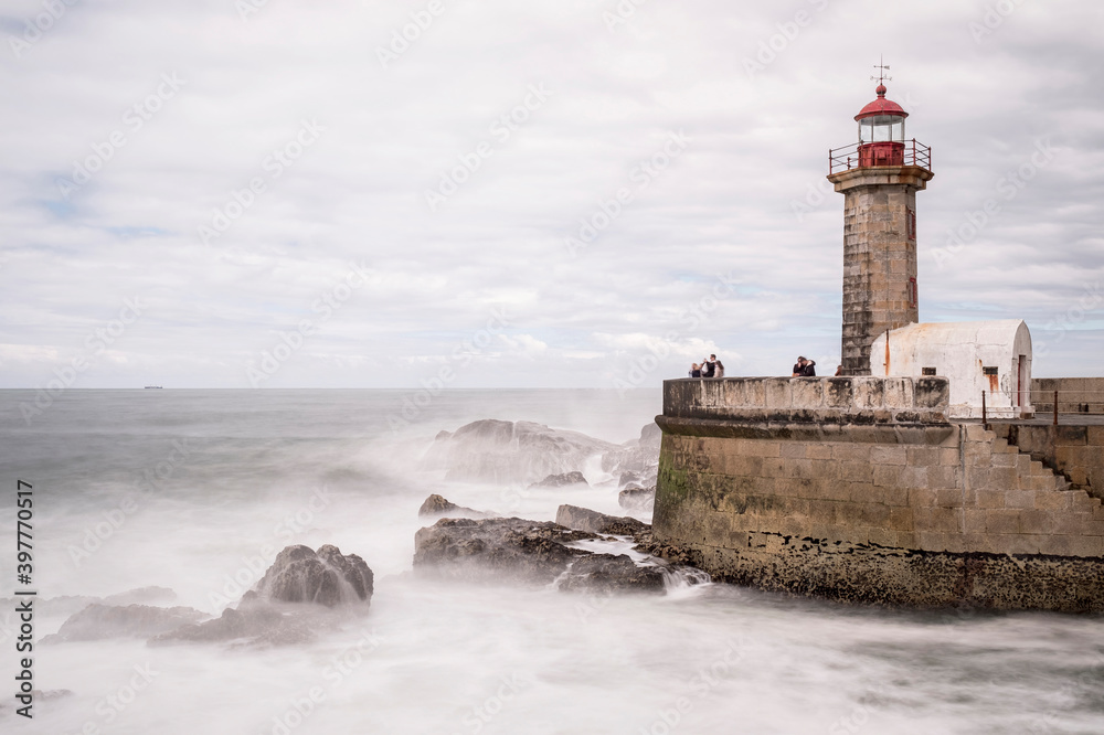 Lighthouse in the Ocean. Lighithouse with rocks. Lighthouse in Portugal. Lighthouse Seascape. Farolim de Felgueiras
