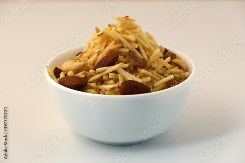 Indian style deep fried snacks falahari chivda- chivda or mixture namkeen with dry fruits.