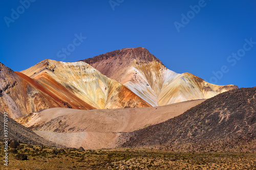 Landscape with the colorful volcano Cerro Cosapilla under blue sky in the north of Chile