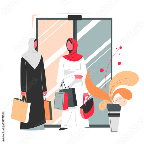 Muslim women with bags shopping in mall vector