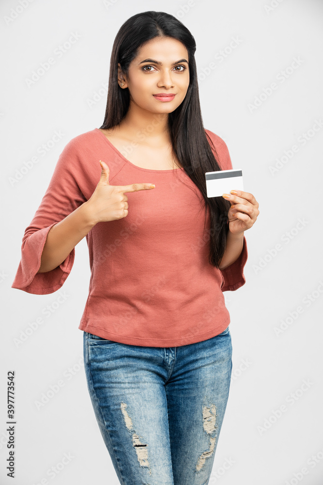 Beautiful young woman holding credit card on white. Beautiful young woman holding credit card on white.
