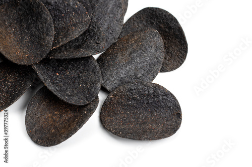 Chips black. Chips with added charcoal and peppers. White background