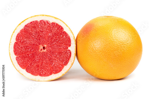 Half and slice of grapefruit isolated on white