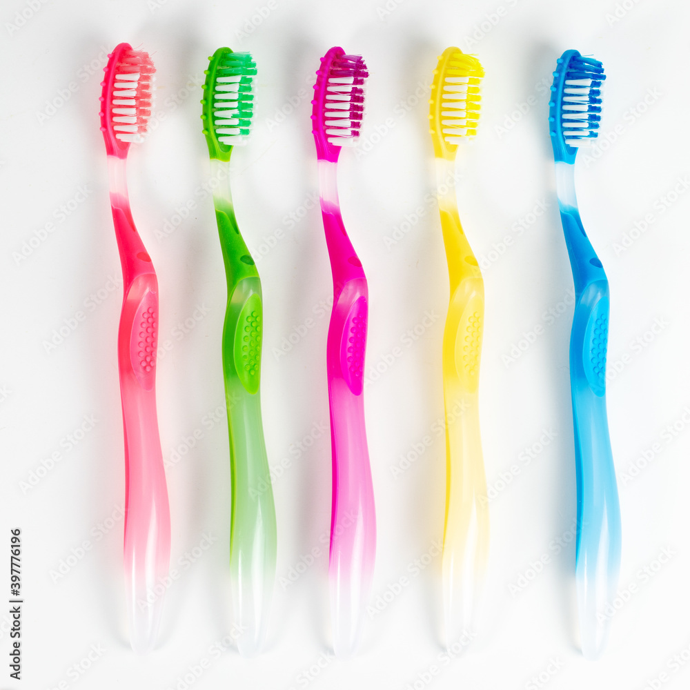 Set colorful toothbrushes on white background Set colorful toothbrushes on white background