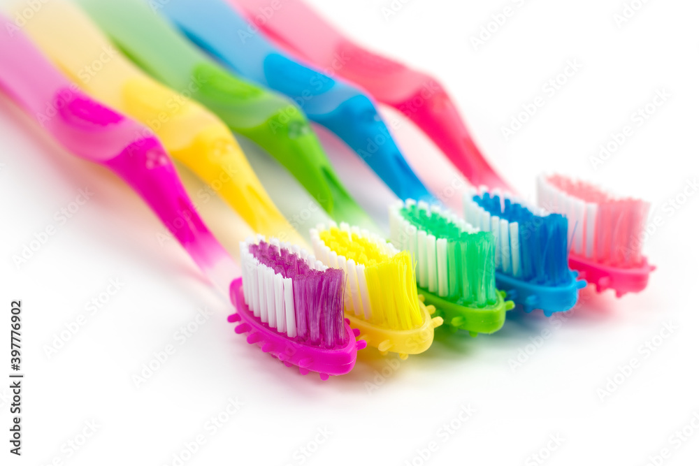 Set colorful toothbrushes on white background Set colorful toothbrushes on white background