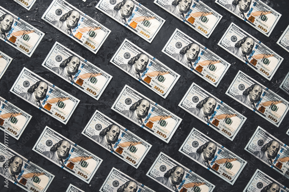 One hundred dollar bills are creatively laid out. Business concept, development perspective. One hundred dollar bills are creatively laid out. Business concept, development perspective.