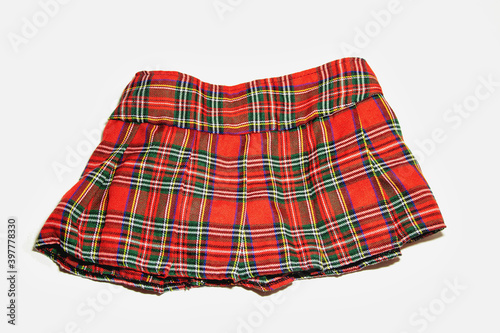 Принти на полотні Red plaid mini skirt isolated on white background