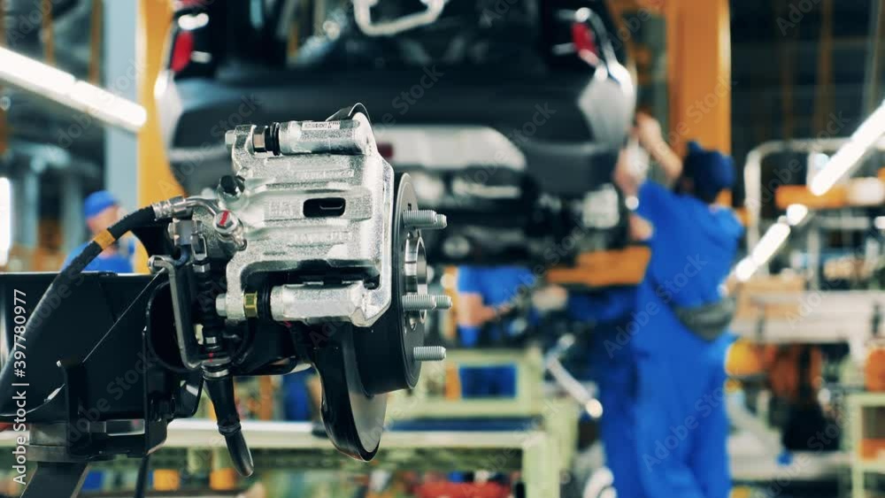 Car part at a car production factory. Automobile factory facility, car production process. Car part at a car production factory. Automobile factory facility, car production process.