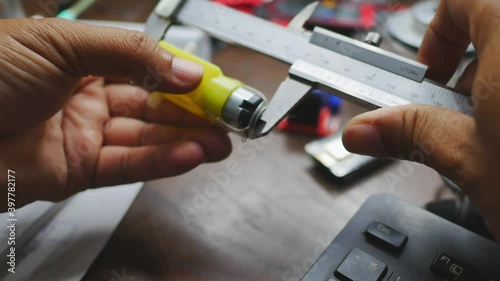 Wallpaper Mural A man inspecting the parts of the car model in preparation for assembly. Favorite hobby idea Torontodigital.ca