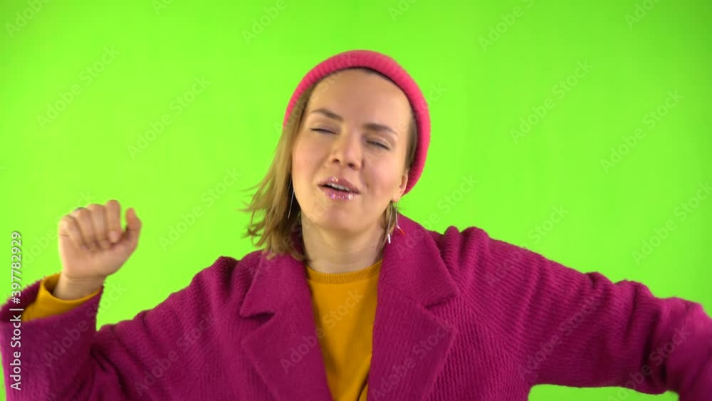 Stylish Woman in Hat and Red Coat Dancing Like Crazy. Emotions of Joy, Fun and Relax. Studio Footage, Creen Background, Isolate. Stylish Woman in Hat and Red Coat Dancing Like Crazy. Emotions of Joy, Fun and Relax. Studio Footage, Creen Background, Isolate.