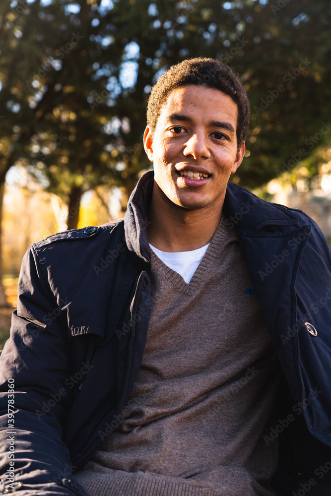 Portrait of a young man looking directly to camera. Portrait of a young man looking directly to camera.
