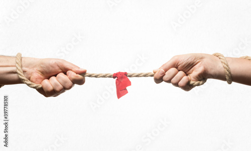 A man and a woman are tug of war. Concept. photo