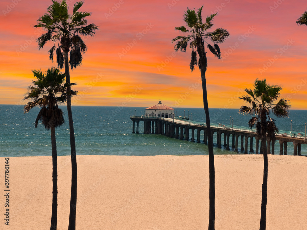 Obraz premium View of Manhattan Beach pier with sunset sky in scenic Southern California.