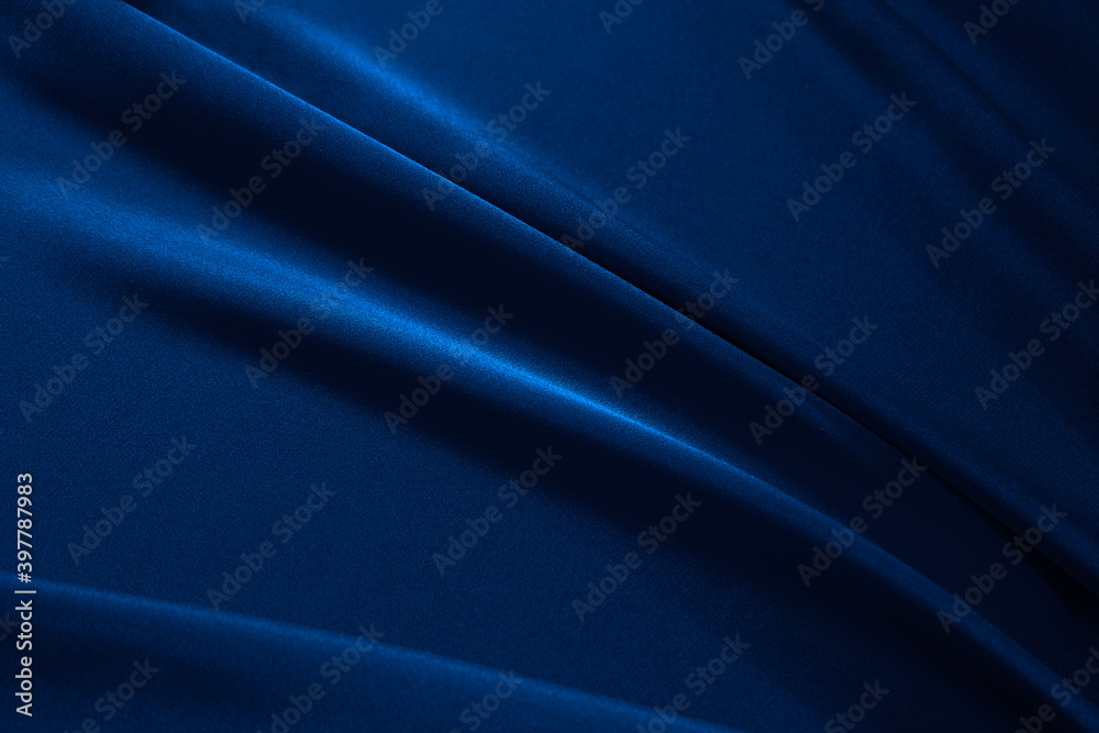 Navy blue elegant abstract background. Silk satin fabric with nice folds. Beautiful dark blue background with wavy lines. Copy space.