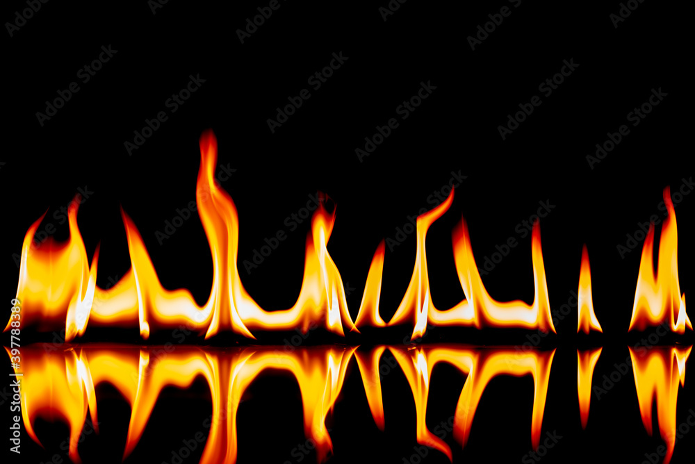 The flames on the glass black background. The flames on the glass black background.