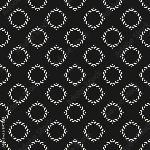 Vector ornamental seamless pattern. Black and white geometric ornament texture with small flower silhouettes, diamonds. Abstract monochrome floral background. Dark repeat design for decor, print © Olgastocker