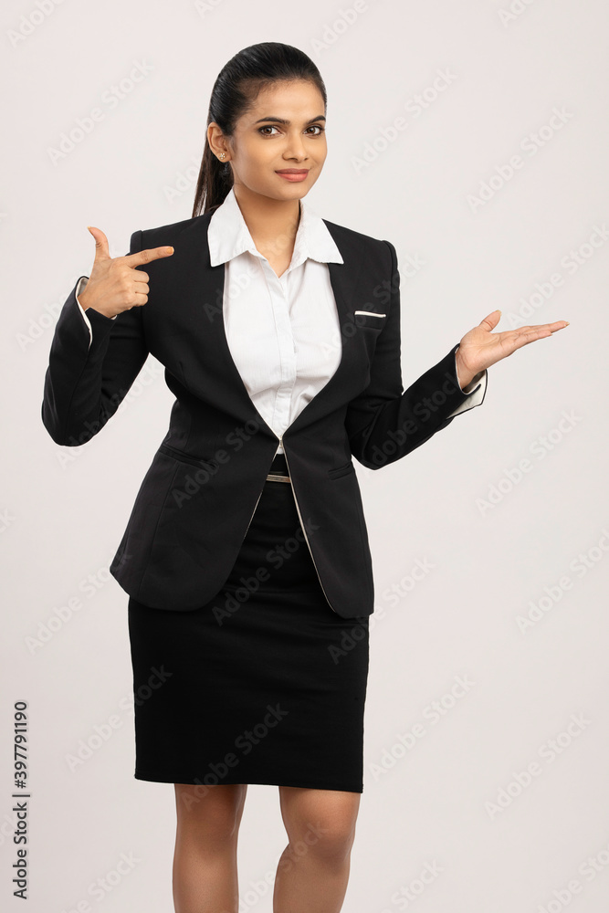 Pretty Indian business woman greeting on white. Pretty Indian business woman greeting on white.
