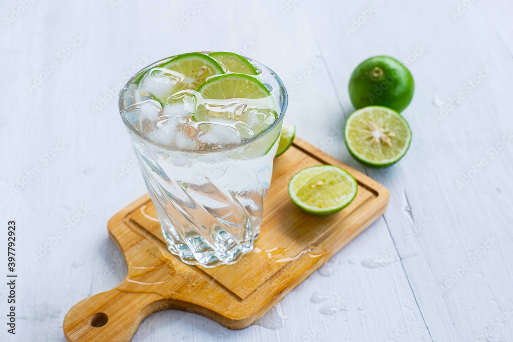 Fototapeta premium A glass of soda, lemon and lime on the table