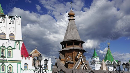 Church of St. Nicholas in Izmailovsky Kremlin (Kremlin in Izmailovo) against the moving clouds, Moscow, Russia. The new church, built in the traditions of Russian wooden architecture photo