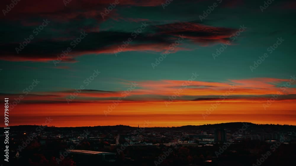 clouds in the sky during sunrise over the time lapse city. clouds in the sky during sunrise over the time lapse city.