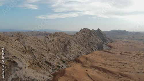Drone view UAE's Al Faya Mountain range landscape, Sharjah's Mleiha desert, Al Faya desert, Hajar mountains, 4k winter drone footage photo