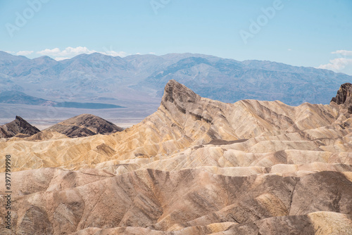 colorful rocks above Death Valley National Park landscape in the desert