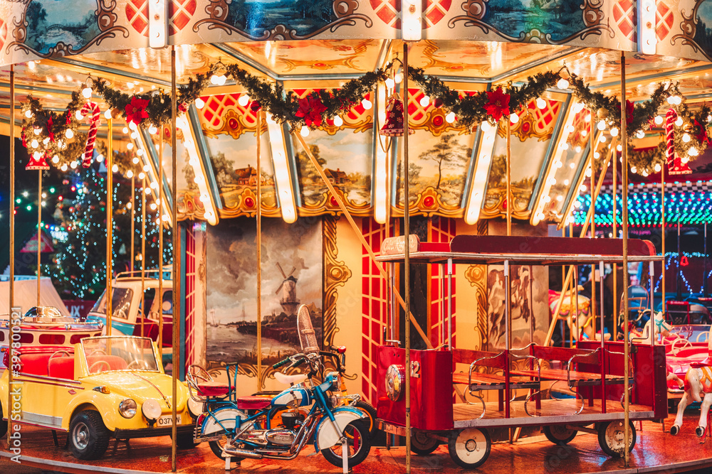 Illuminated Christmas carousel in the amusement park