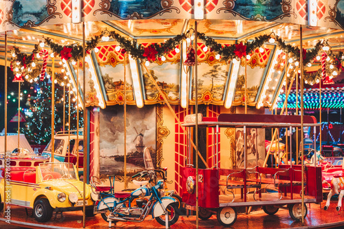 Illuminated Christmas carousel in the amusement park