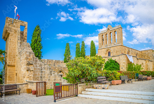 Ruins of Bellapais Abbey monastery stone building in Kyrenia Girne district, blue sky white clouds background, Northern Cyprus photo