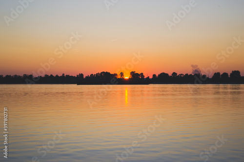 sunset over the river © Ekaterina