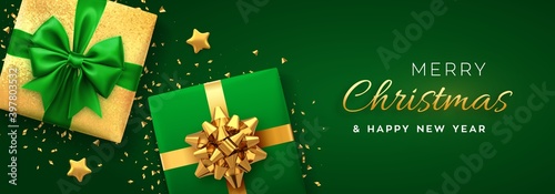Christmas banner. Realistic gift boxes with green and golden bow, gold stars and glitter confetti. Xmas background, horizontal christmas poster, greeting cards, headers website. Vector illustration.