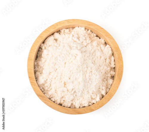 Milk powder in wooden bowl on white background.