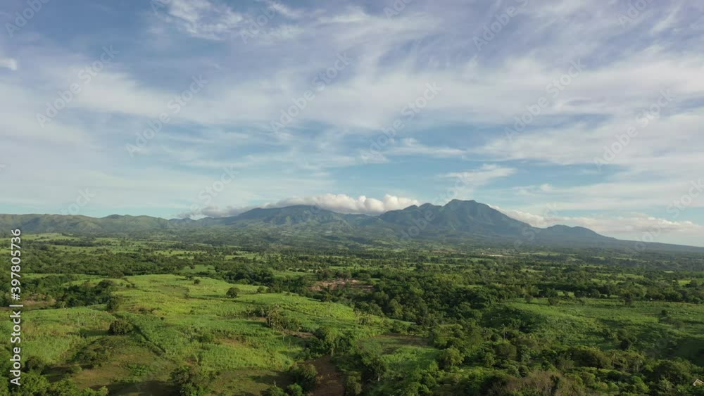 Aerial view of a landscape in Negros Oriental, Philippines, with mountains and clouds. Nature concept. Blue and green scenario. 4k Aerial view of a landscape in Negros Oriental, Philippines, with mountains and clouds. Nature concept. Blue and green scenario. 4k