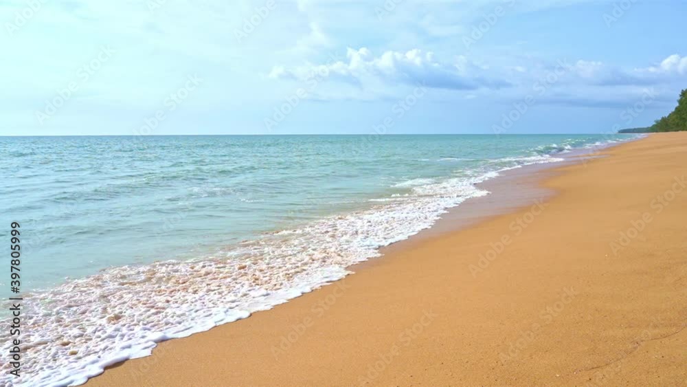 Slow-motion of waves crashing on golden beach Lockdown shot Slow-motion of waves crashing on golden beach Lockdown shot