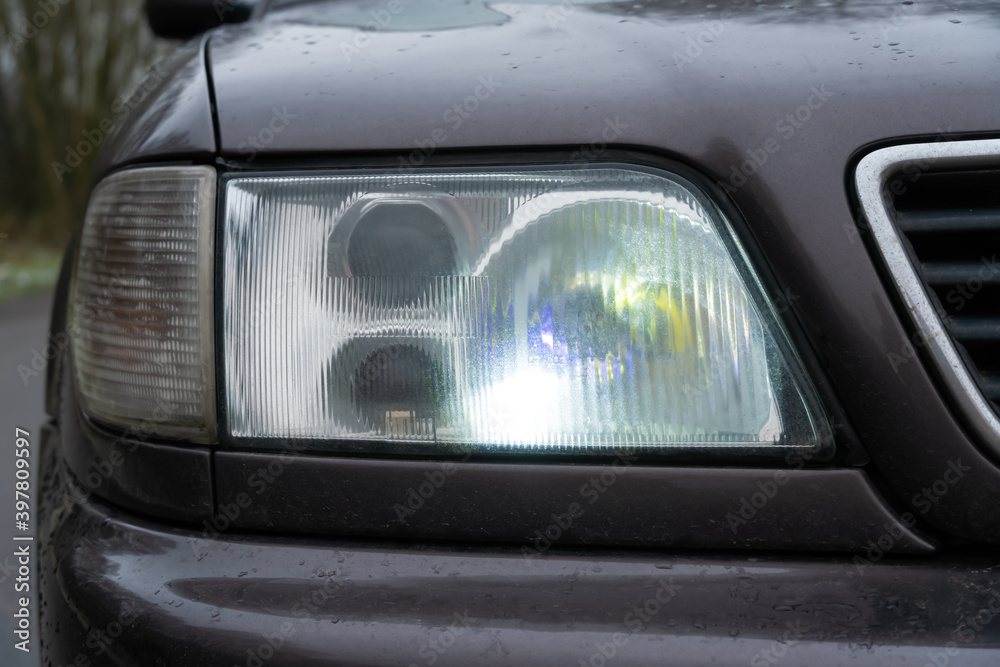 Close-up of the car's fog lights. Headlights in the car, close-up. Close-up of white car headlights. Passing beam. Right headlight