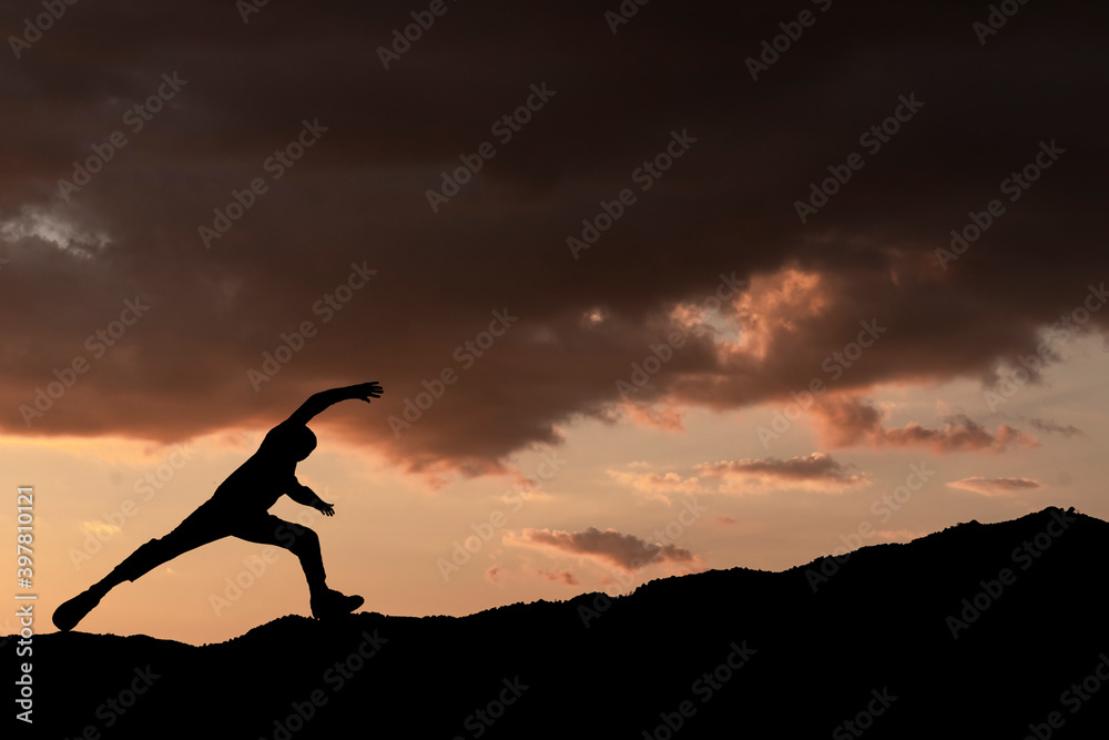 concept to overcome difficulties. man climbing steep mountain