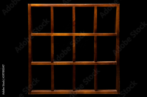 Vintage empty wooden shelf isolated on black background.