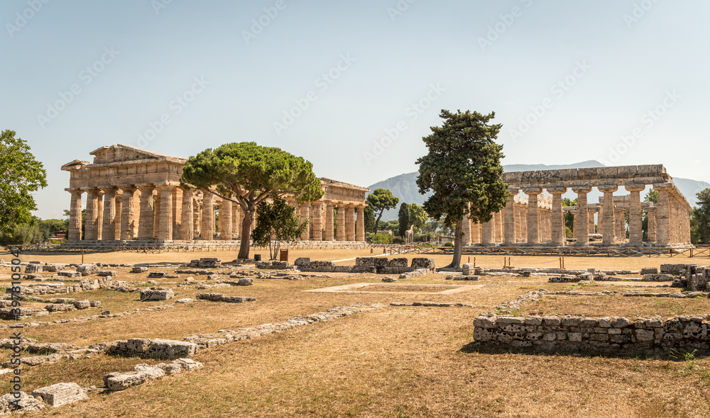 Fototapeta premium Archaeological site of Paestum , Archaic Temple and Temple of Hera II (also erroneously called the Temple of Neptune or of Poseidon), Campania, Italy