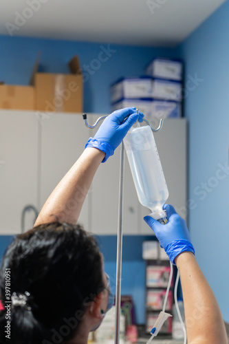 Nurse placing physiological saline solution