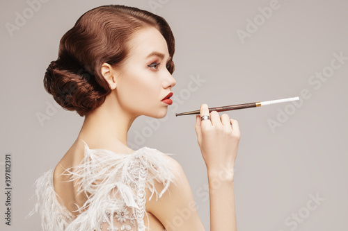 lady smokes a cigarette photo