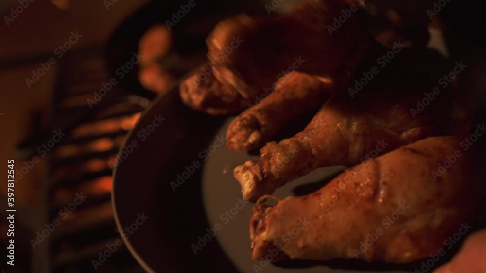 Barbecuing chicken drumsticks, cooked chicken legs off campsite BBQ, closeup Barbecuing chicken drumsticks, cooked chicken legs off campsite BBQ, closeup