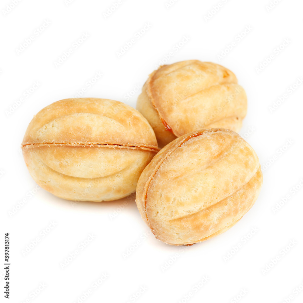Traditional Russian nuts with condensed milk isolated on white background. Nuts cakes for New Year's holidays.
