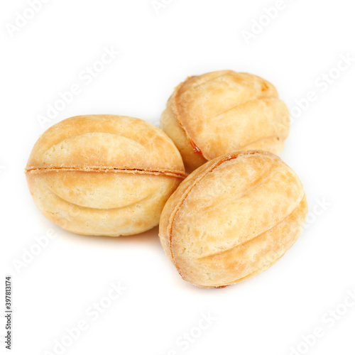 Traditional Russian nuts with condensed milk isolated on white background. Nuts cakes for New Year's holidays.