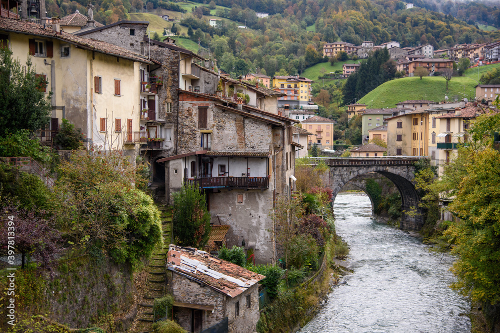 Old houses in San Giovanni Bianco, Bergamo, Italy. Ancient village of Italy. View of the Enna stream.