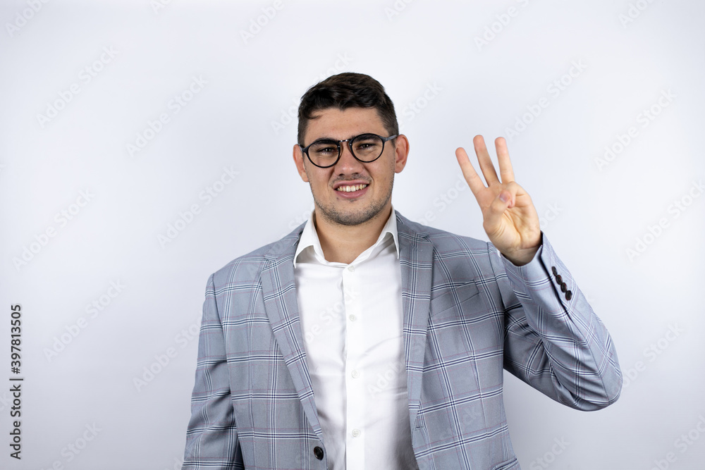 Business young man wearing a casual shirt over white background smiling confident and happy showing number three with fingers Business young man wearing a casual shirt over white background smiling confident and happy showing number three with fingers
