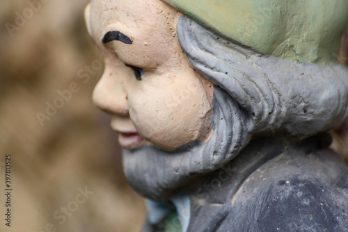 Detail of decorative terracotta dwarf statues for homes. Mountain gnomes. photo