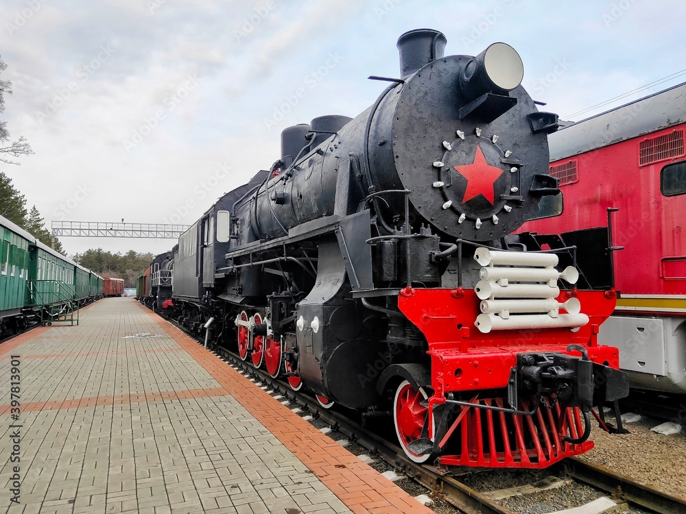 old steam locomotive of black and red color. old steam locomotive of black and red color.