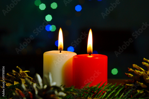 burning candle and christmas tree