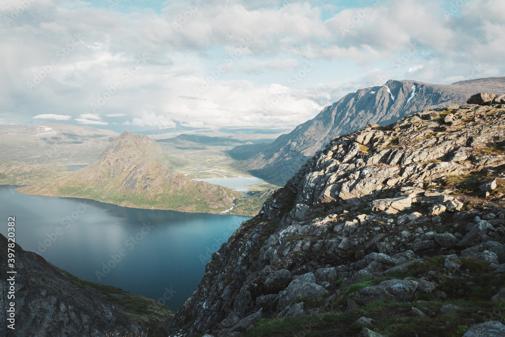 River and lake in the mountains. Sky in the clouds Norwegian mountains